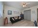 Bedroom featuring a sofa, dresser and ceiling fan at 7336 Brookhaven Ter, Englewood, FL 34224