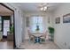 Bright breakfast nook with table and chairs, near sliding glass doors at 7336 Brookhaven Ter, Englewood, FL 34224