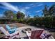 Fire pit area with colorful chairs in backyard at 7336 Brookhaven Ter, Englewood, FL 34224