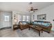 Spacious living room with brown sofas, blue pillows, and a coffee table at 7336 Brookhaven Ter, Englewood, FL 34224