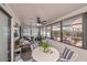 Relaxing sunroom featuring a white table and comfy seating at 7336 Brookhaven Ter, Englewood, FL 34224