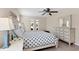 Serene bedroom with a starfish comforter and plenty of natural light at 7398 Spinnaker Blvd, Englewood, FL 34224