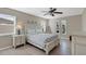 Bedroom with a queen-size bed, dresser, and ceiling fan at 7398 Spinnaker Blvd, Englewood, FL 34224