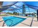 Relaxing screened pool area with canal views at 7398 Spinnaker Blvd, Englewood, FL 34224