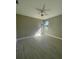 Spacious bedroom with light grey walls and wood-look tile flooring at 7410 Grand Concourse St, Englewood, FL 34224