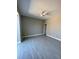 Spacious bedroom with ceiling fan and wood-look tile flooring at 7410 Grand Concourse St, Englewood, FL 34224