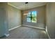 Formal dining room with large window and modern chandelier at 7410 Grand Concourse St, Englewood, FL 34224