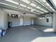 Spacious garage with epoxy flooring and high ceilings at 7410 Grand Concourse St, Englewood, FL 34224