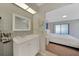 Modern bathroom with white vanity and gray brick wall at 7438 Banbury Ter, Port Charlotte, FL 33981