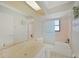 Bathroom with tub, toilet and vanity at 7438 Banbury Ter, Port Charlotte, FL 33981