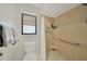 Bathroom with shower, toilet and grab bar at 7438 Banbury Ter, Port Charlotte, FL 33981