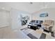 Bright living room with tiled floors, comfy seating, and a bay window at 7438 Banbury Ter, Port Charlotte, FL 33981