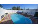 Inviting kidney-shaped pool with patio furniture at 7438 Banbury Ter, Port Charlotte, FL 33981