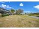 A verdant backyard extends to a tranquil canal, enhancing the outdoor living experience at 8 Broadmoor Ln, Rotonda West, FL 33947