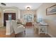 Bright home office featuring wood-look tile floors, ample natural light, and workspace at 8 Broadmoor Ln, Rotonda West, FL 33947