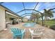 Inviting screened pool with outdoor seating and a serene backyard view at 8 Broadmoor Ln, Rotonda West, FL 33947