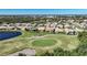 Aerial view of homes and golf course at 8377 Parkside Dr, Englewood, FL 34224