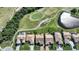 Aerial view of houses near golf course and pond at 8377 Parkside Dr, Englewood, FL 34224