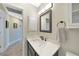 Clean and modern bathroom with single vanity and updated fixtures at 8377 Parkside Dr, Englewood, FL 34224