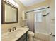 Clean bathroom, featuring a bathtub, marble vanity, and updated fixtures at 8377 Parkside Dr, Englewood, FL 34224