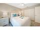 Spacious bedroom with a queen bed and neutral decor at 8377 Parkside Dr, Englewood, FL 34224