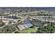 Aerial view of community with various amenities and homes at 8377 Parkside Dr, Englewood, FL 34224