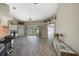 Open concept kitchen with white cabinetry and breakfast bar, overlooking a golf course at 8377 Parkside Dr, Englewood, FL 34224