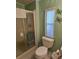 Clean bathroom with a shower/tub combo and a window at 8479 Tanaka Dr, Englewood, FL 34224