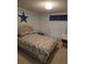 Cozy bedroom with a seashell-themed bedspread and a star accent at 8479 Tanaka Dr, Englewood, FL 34224