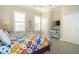 King-size bed, colorful quilt, and built-in dresser at 8960 Scallop Way, Placida, FL 33946