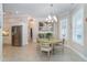 Bright dining area with a round table and chairs, adjacent to the kitchen at 8960 Scallop Way, Placida, FL 33946