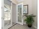 Glass French door leading to a covered patio area at 8960 Scallop Way, Placida, FL 33946