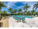 Resort-style pool with lounge chairs and a relaxing patio area at 8960 Scallop Way, Placida, FL 33946