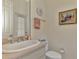 Simple yet functional bathroom with a single sink and toilet at 910 Park Place Dr, Englewood, FL 34223