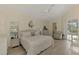 Spacious main bedroom with pool access and en-suite bathroom at 910 Park Place Dr, Englewood, FL 34223