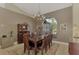 Formal dining room features hardwood table and buffet at 910 Park Place Dr, Englewood, FL 34223