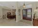 Elegant entryway with double doors and views into dining room at 910 Park Place Dr, Englewood, FL 34223