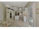 Spacious kitchen boasts white cabinets, large island, and stainless steel appliances at 910 Park Place Dr, Englewood, FL 34223