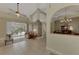 Open living room, high ceilings, view of dining area at 910 Park Place Dr, Englewood, FL 34223