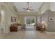 Spacious living area with high ceilings and pool view at 910 Park Place Dr, Englewood, FL 34223