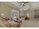 Relaxing living room, featuring patio access and two sofas at 910 Park Place Dr, Englewood, FL 34223