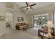 Bright living room with view of pool and bedroom at 910 Park Place Dr, Englewood, FL 34223