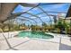 Relaxing screened pool area, perfect for outdoor enjoyment at 910 Park Place Dr, Englewood, FL 34223