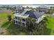 Large home with a rooftop deck and screened porch at 9860 Eagle Preserve Dr, Englewood, FL 34224