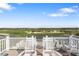 Golf course view from the roof, features rocking chairs at 9860 Eagle Preserve Dr, Englewood, FL 34224