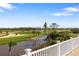 View of golf course and pond from rooftop deck at 9860 Eagle Preserve Dr, Englewood, FL 34224