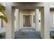 Inviting front entrance with stone tile and decorative pillars leads to the home's front door at 9861 Eagle Preserve Dr, Englewood, FL 34224