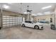 A spacious multi-car garage with ample lighting and storage space at 9861 Eagle Preserve Dr, Englewood, FL 34224