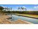 Swimming pool with a stairway and unobstructed water view at 9861 Eagle Preserve Dr, Englewood, FL 34224