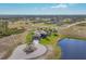 Single-Gathering home with pool and circular driveway, offering a serene waterfront view at 1 Calm Ct, Placida, FL 33946